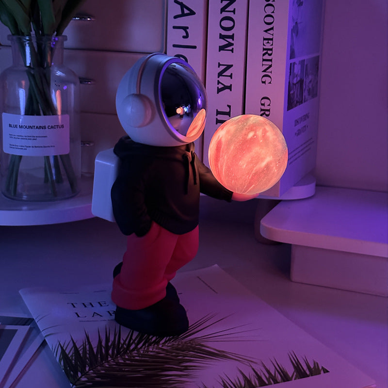 Holding the dreamy starry sky (black top + red pants) Creative Astronaut Bluetooth Speaker with 3D Starry Sky Lighting,