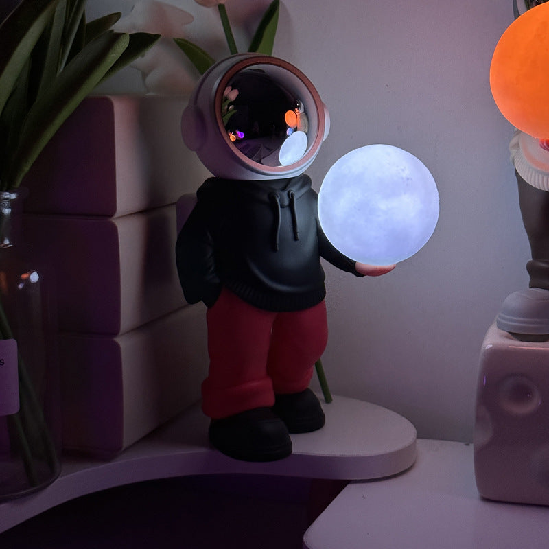 Holding the romantic moon (black top + red pants) Creative Astronaut Bluetooth Speaker with 3D Starry Sky Lighting, Port