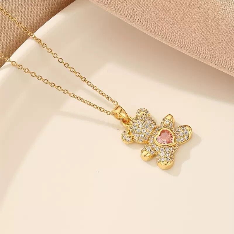 A delicate and adorable pink heart-shaped bear pendant copper necklace, adorned with synthetic zirconia, paired with a stainless steel chain, decorated with synthetic zirconia, perfect as a daily jewelry gift or a sweet and cute party accessory.（gold））