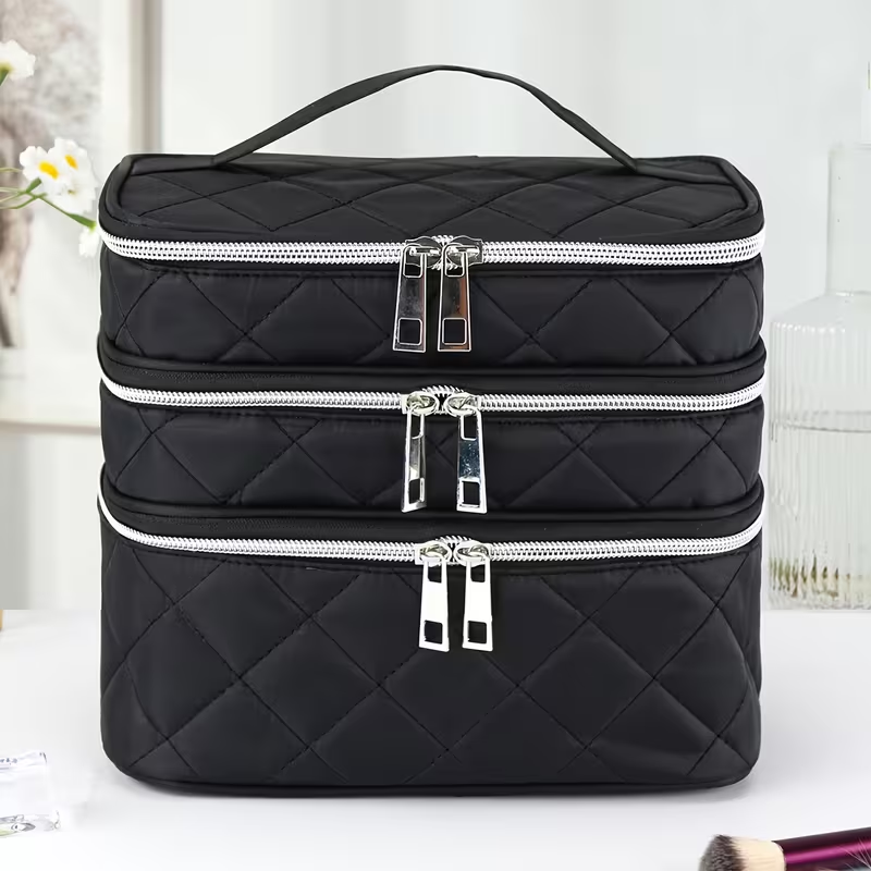 Fashionable and light luxury large-capacity black embroidered diamond-shaped cosmetic bag with three  for multi-level storage, portable and hand-held, suitable for home and travel use.