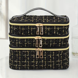 Fashionable and light luxury large-capacity black embroidered diamond-shaped cosmetic bag with three  for multi-level storage, portable and hand-held, suitable for home and travel use.