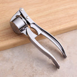 Stainless steel garlic press - Heavy-duty manual garlic press - With ergonomic handle - Easy-to-clean kitchen tool - Can be used to make garlic and ginger paste - Dishwasher safe