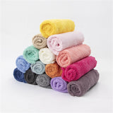 White microfiber cleaning cloth folded neatly.