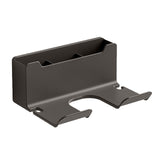 White wall-mounted hair dryer holder with curved design.