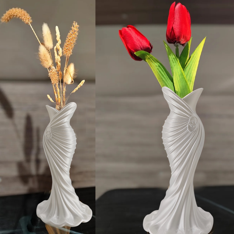 This elegant dress vase combines high-fashion elegance with minimalist home décor. Whether you insert real flowers into the glass tube or display artificial flowers without the tube, it is exceptionally beautiful.