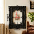 A gorgeous 3D-printed wall-mounted picture frame, perfect for displaying antique prints. Black.