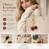 Compact red cherry bag charm with single gold leaf, gentle warm sweetness stays by your side anytime