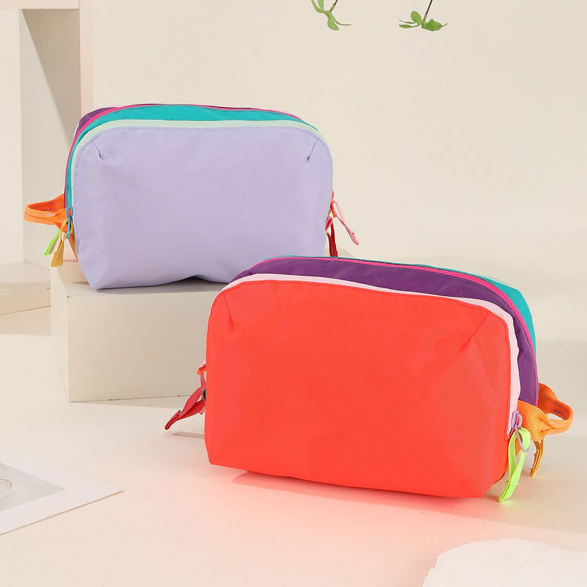 Dopamine Color-Blocking Cosmetic Bag, waterproof with large capacity, layered storage for skincare and makeup, easy opening and closing with drawstring zipper, essential sweet storage item for travel and commuting./(front) light purple (back) bright orang