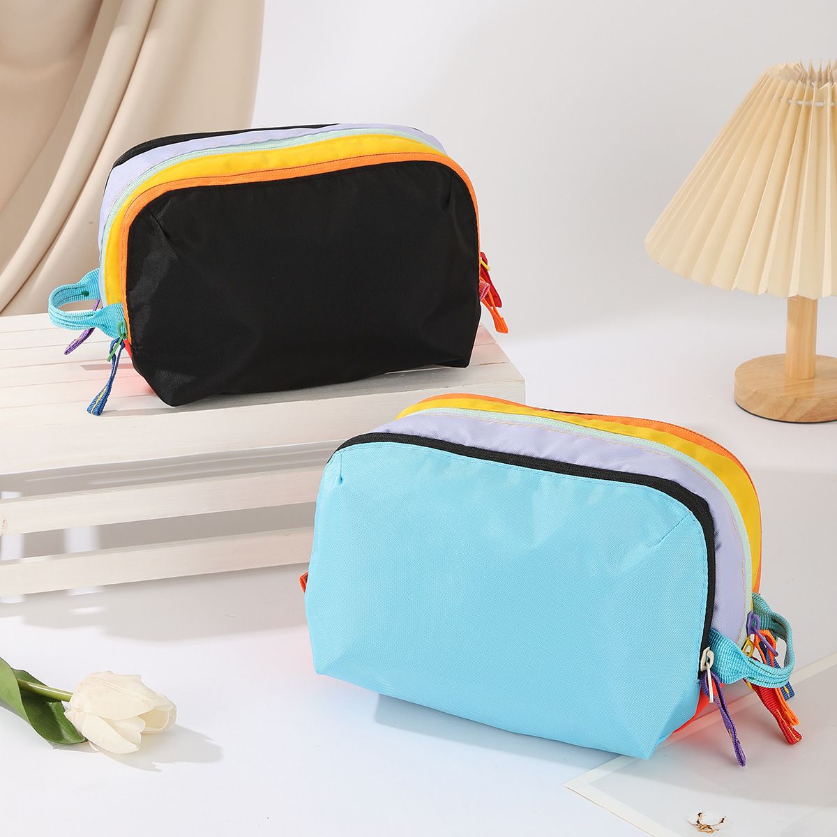 Dopamine Color-Blocking Cosmetic Bag, waterproof with large capacity, layered storage for skincare and makeup, easy opening and closing with drawstring zipper, essential sweet storage item for travel and commuting./(front) black (back) sky blue