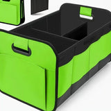 Green foldable car trunk organizer with reinforced handles and multiple compartments.