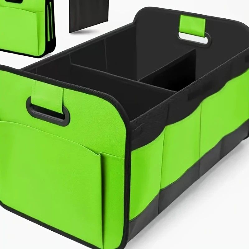 Green foldable car trunk organizer with reinforced handles and multiple compartments.