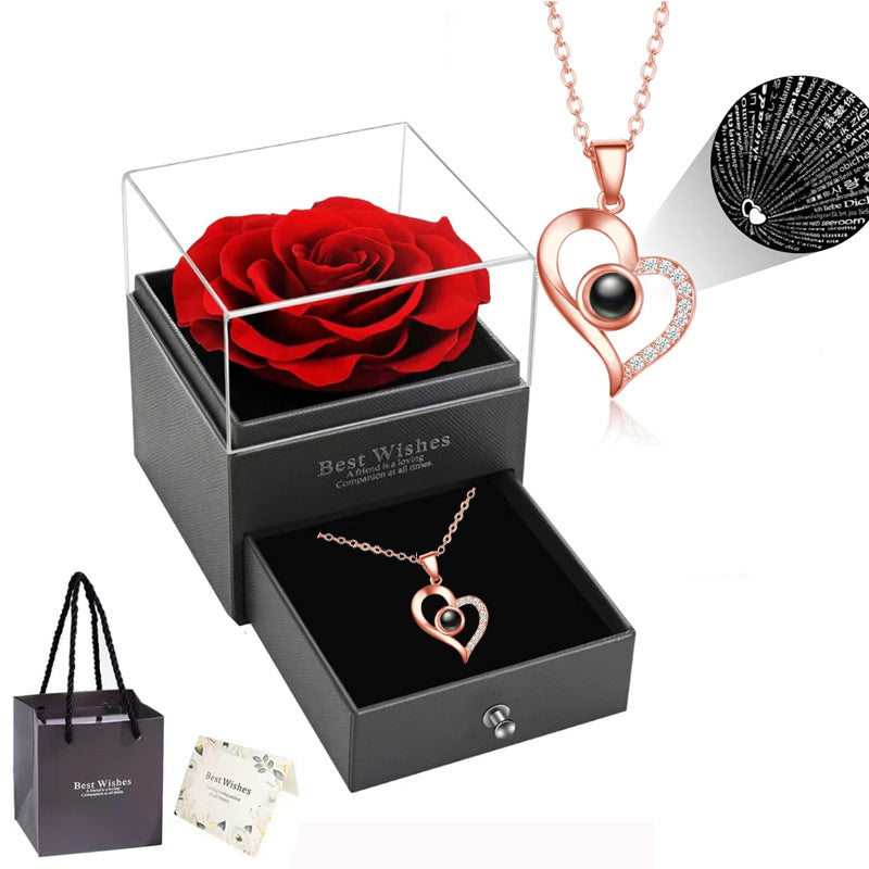 Rose Heart Projection Necklace, sparkling in rose gold, "I love you" in 100 languages, packaged with a single rose gift box – a romantic tech-infused gift.