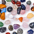 Assorted natural tumbled stones in various colors and sizes.