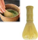 Resin matcha whisk with a handle and tines.