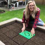 Color-coded seed spacer tool with dibber, spoon, ruler, and planting guide.