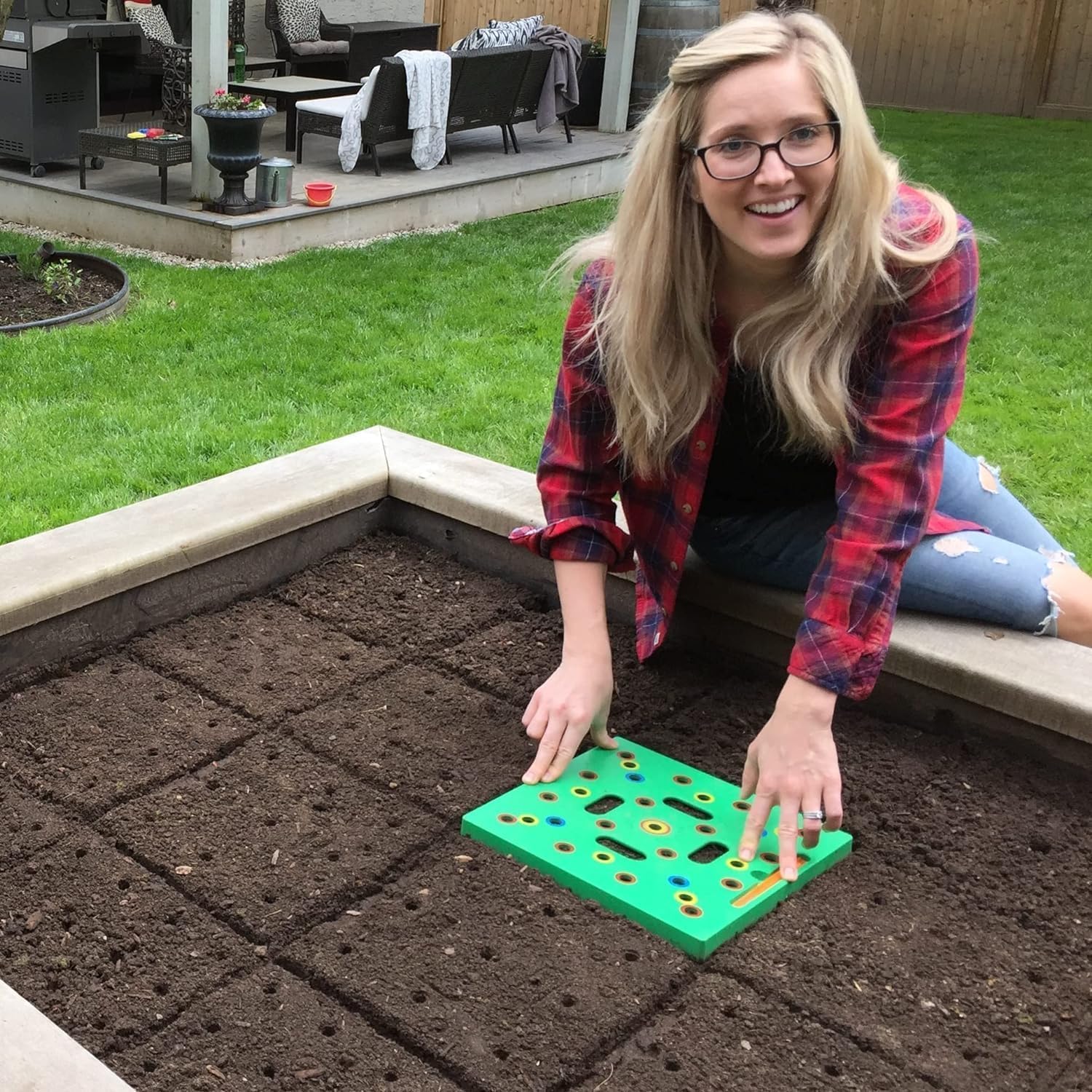 Color-coded seed spacer tool with dibber, spoon, ruler, and planting guide.