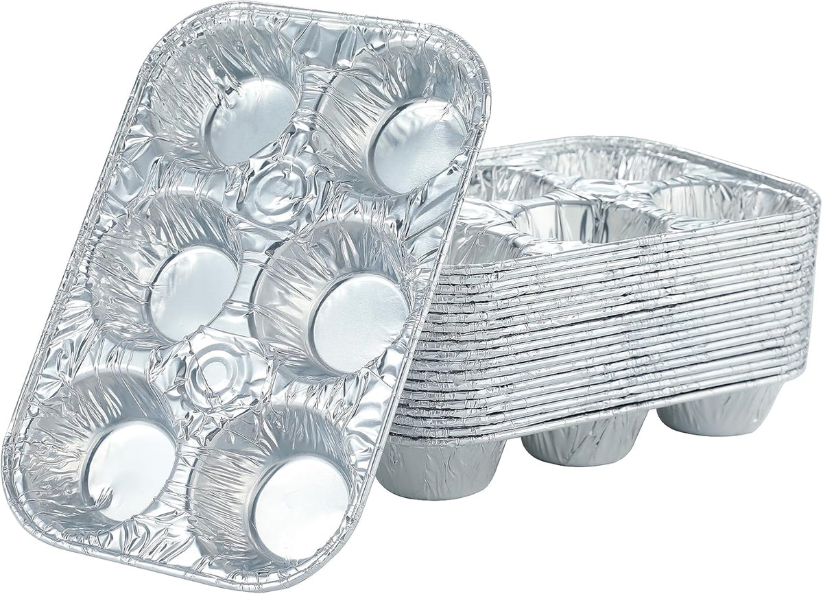 Six-cup aluminum muffin pan with fluted edges.