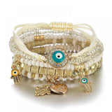 Multicolor beaded stretch bracelet with evil eye charm.