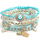 Multicolor crystal beaded stretch bracelet with evil eye charm.