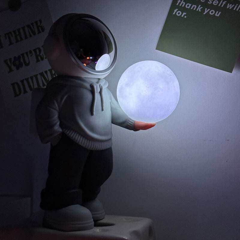 Holding the romantic moon (grey top + navy blue pants) Creative Astronaut Bluetooth Speaker with 3D Starry Sky Lighting,