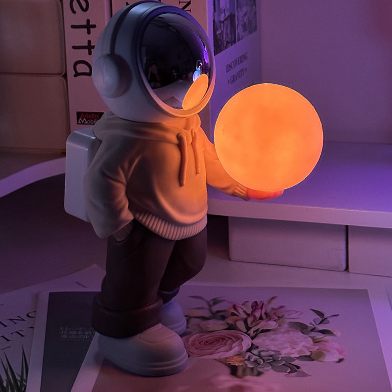 Holding the romantic moon (beige top + brown pants) Creative Astronaut Bluetooth Speaker with 3D Starry Sky Lighting, Po