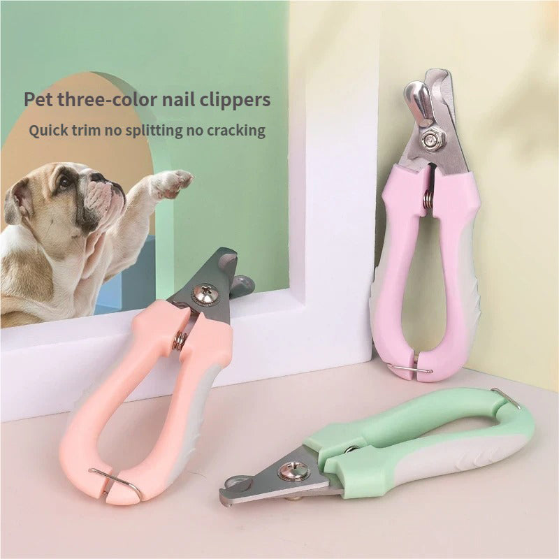Three pet nail clippers in purple, pink, and green.