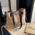 Stylish khaki canvas tote bag with detachable shoulder strap