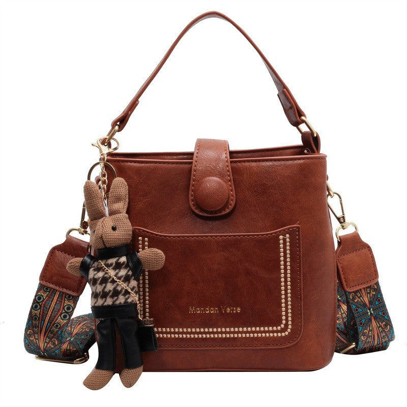 Vintage Style PU Leather Bucket Bag with Wide Patterned Strap & Optional Bunny Charm(caramel)