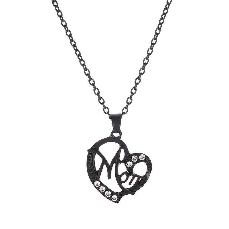 Heart pendant necklace with "MOM" lettering and rhinestones.