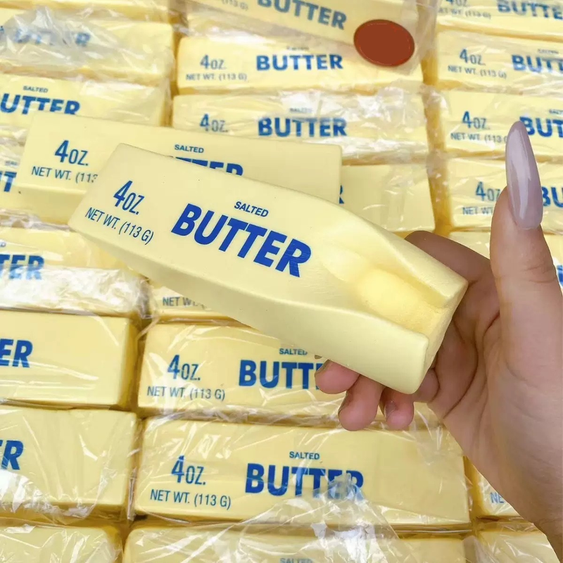 Yellow butter stick squishy toy with wrapper