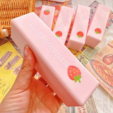Strawberry milk bar squishy toy with a wet, soft texture.