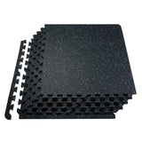 Black and white interlocking gym floor tiles made of rubber top and EVA foam.